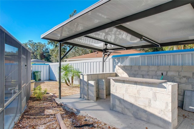 view of patio featuring ceiling fan