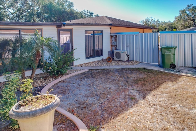 rear view of property featuring ac unit