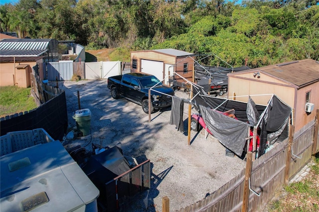 view of yard featuring an outbuilding and a garage