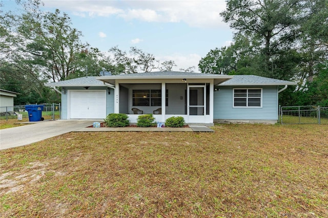 single story home featuring a garage and a front lawn