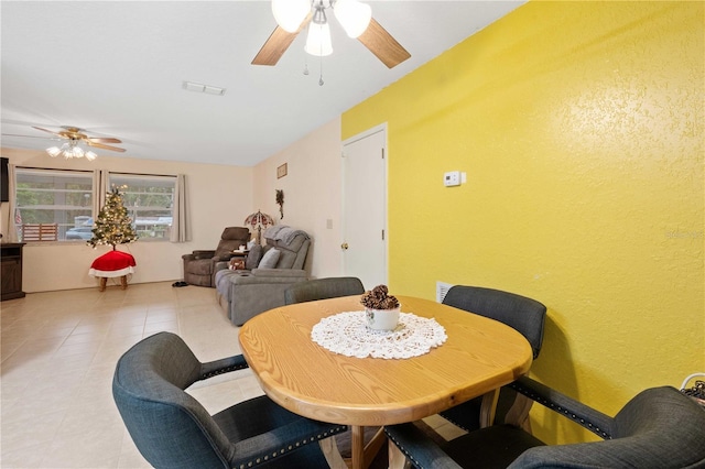 tiled dining room with ceiling fan