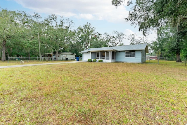 single story home with a garage and a front lawn