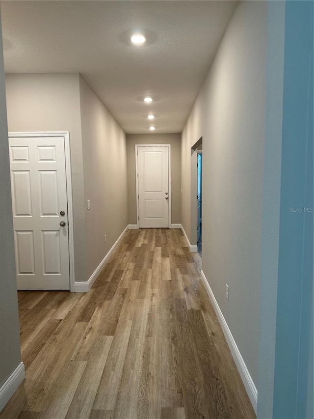 hallway featuring wood-type flooring