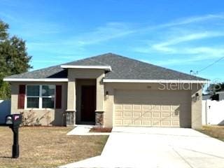 ranch-style house featuring a garage