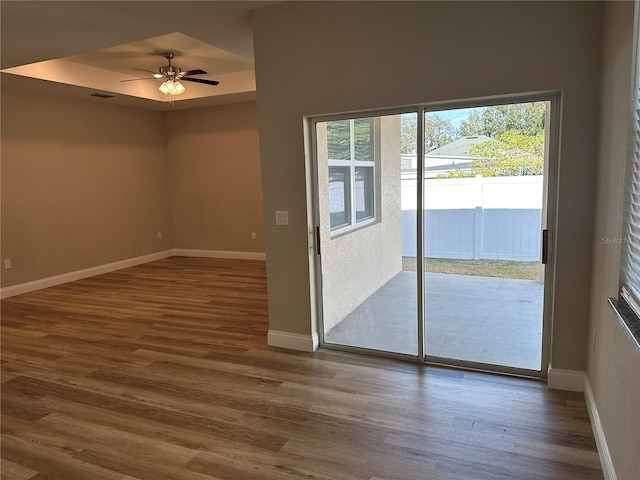 interior space featuring dark wood-type flooring and ceiling fan