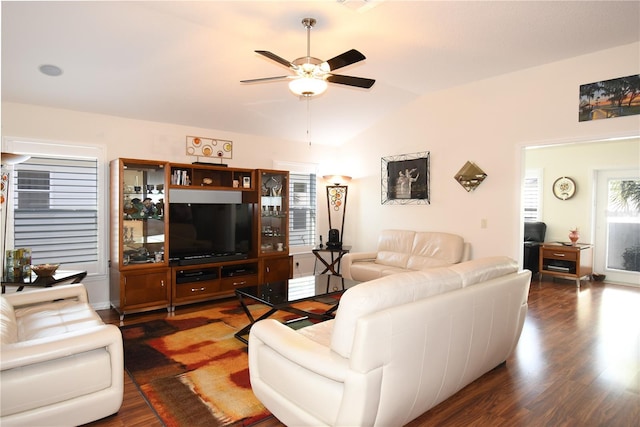 living room with ceiling fan, dark wood-type flooring, and lofted ceiling