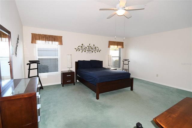 bedroom featuring ceiling fan and carpet