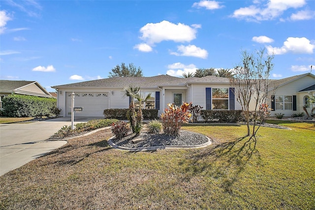 ranch-style house featuring a front yard and a garage