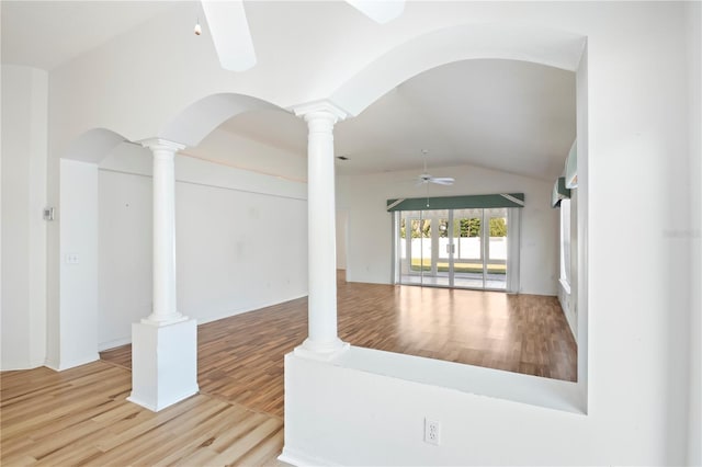 spare room featuring ceiling fan, light wood-type flooring, and vaulted ceiling