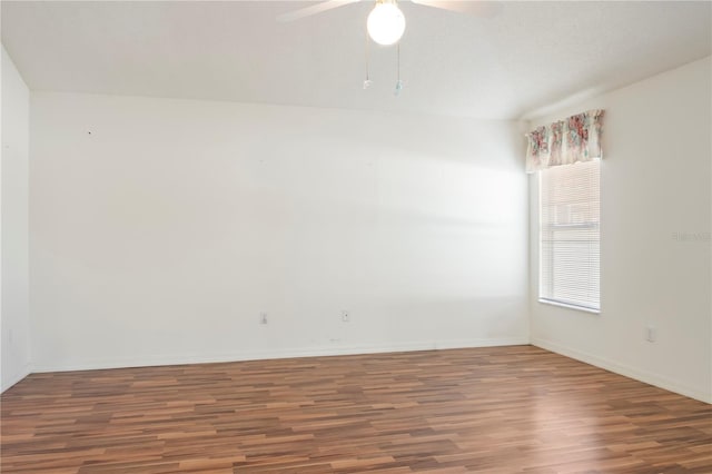 empty room featuring hardwood / wood-style flooring and ceiling fan