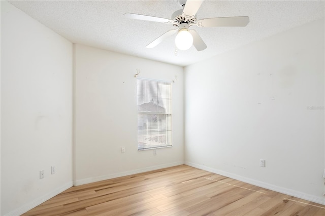 unfurnished room featuring a textured ceiling, light hardwood / wood-style floors, and ceiling fan