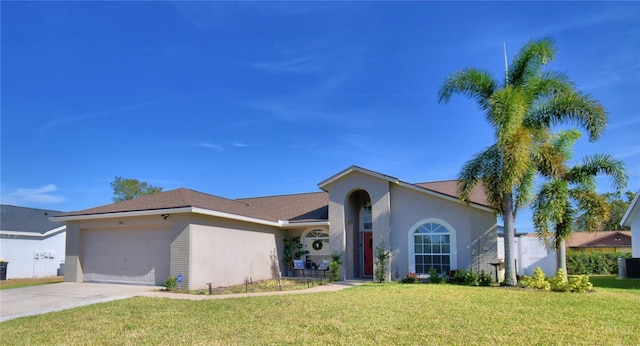 view of front facade with a garage, a front lawn, and central air condition unit