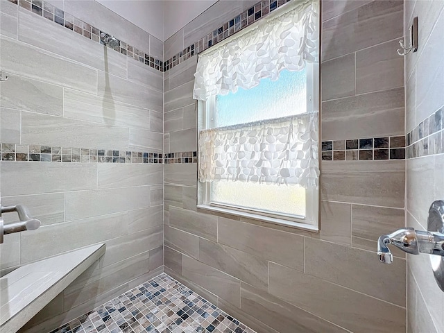 bathroom with tiled shower