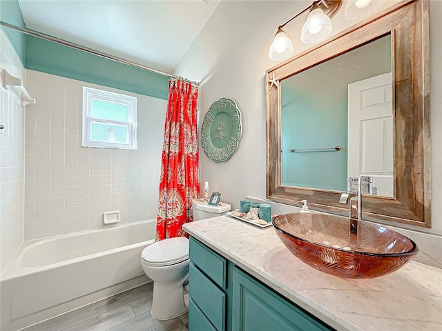 full bathroom with shower / bath combo with shower curtain, vanity, and toilet