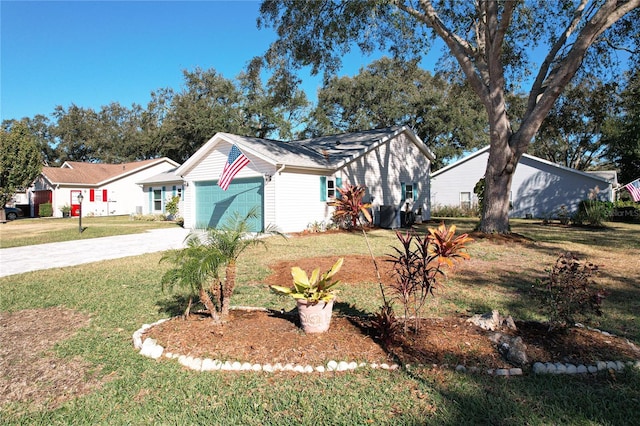 ranch-style home with a garage and a front lawn