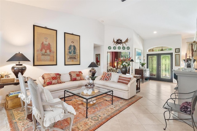 living room featuring french doors, light tile patterned floors, and vaulted ceiling