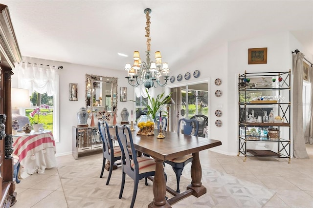 tiled dining area with plenty of natural light and a notable chandelier