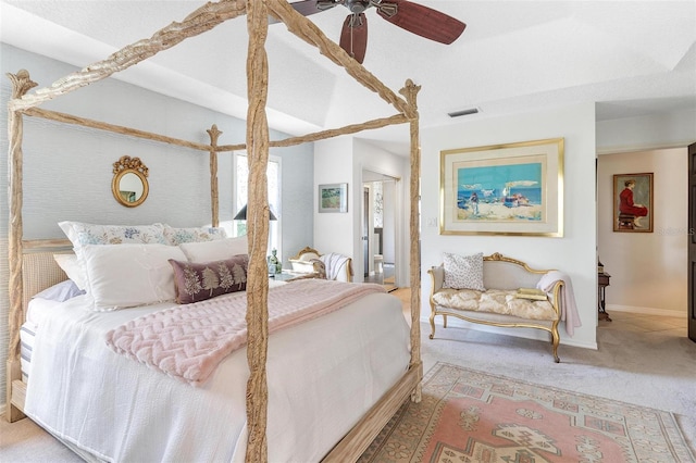 bedroom featuring carpet, ceiling fan, and ensuite bathroom