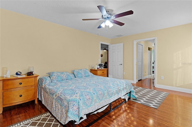 bedroom featuring ceiling fan and wood-type flooring