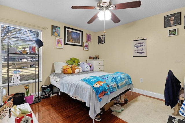 bedroom featuring hardwood / wood-style flooring and ceiling fan