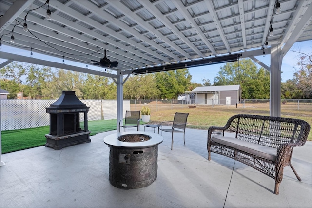 view of patio with a fire pit