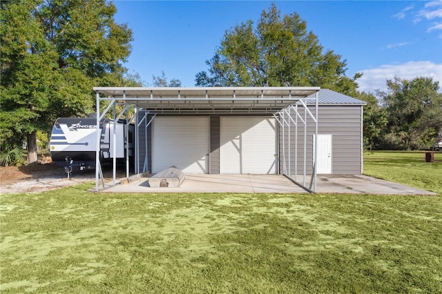 view of outbuilding with a yard and a carport