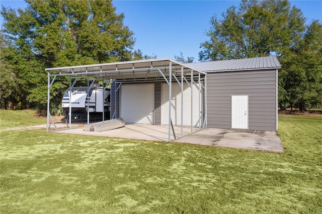 exterior space featuring a yard and a carport