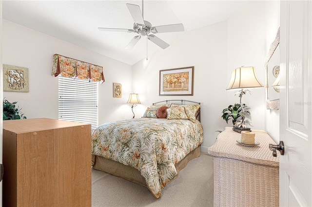 bedroom featuring carpet, ceiling fan, and vaulted ceiling