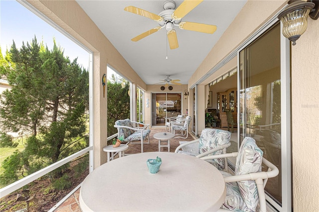 sunroom / solarium with ceiling fan