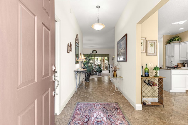 hallway with light tile patterned floors