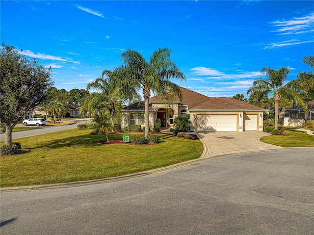 view of front of property featuring a front yard and a garage