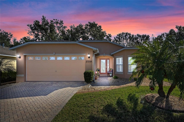 ranch-style home with a garage