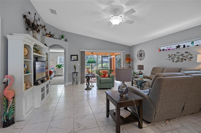 living room with ceiling fan and lofted ceiling