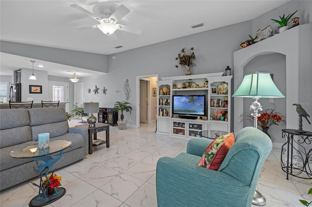 living room with ceiling fan and lofted ceiling