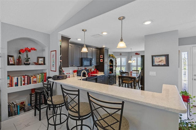 kitchen with lofted ceiling, electric stove, hanging light fixtures, a kitchen bar, and kitchen peninsula