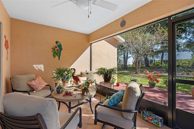 sunroom with a wealth of natural light and ceiling fan