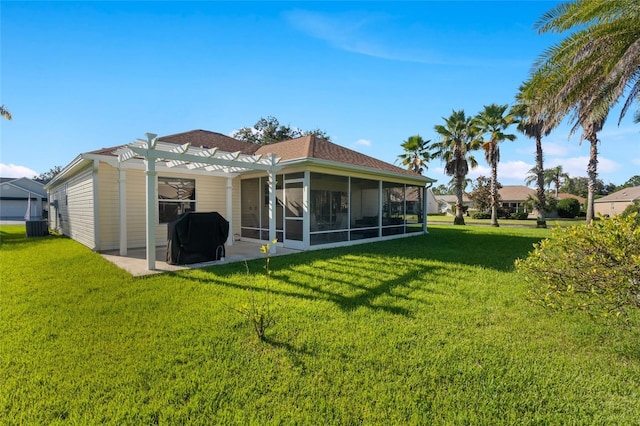 back of property featuring a yard, a patio, a sunroom, and a pergola