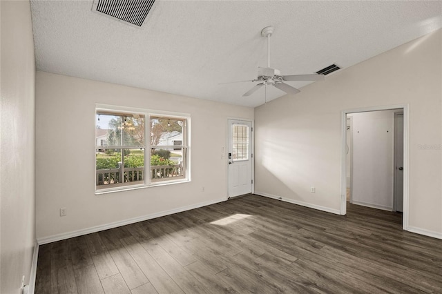 unfurnished living room with ceiling fan, a textured ceiling, dark hardwood / wood-style floors, and lofted ceiling