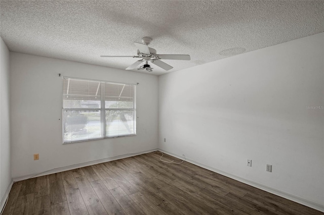 spare room with ceiling fan, hardwood / wood-style floors, and a textured ceiling