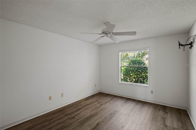 unfurnished room featuring ceiling fan, hardwood / wood-style floors, and a textured ceiling