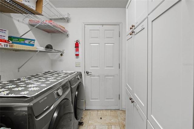 washroom with washer and clothes dryer