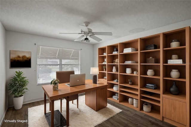 office area featuring dark hardwood / wood-style flooring and ceiling fan