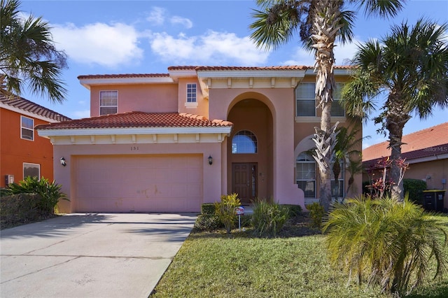 mediterranean / spanish-style home featuring a garage