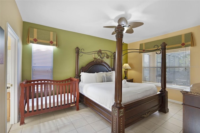 tiled bedroom with ceiling fan