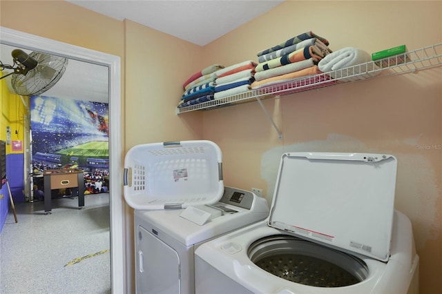 washroom with washing machine and clothes dryer