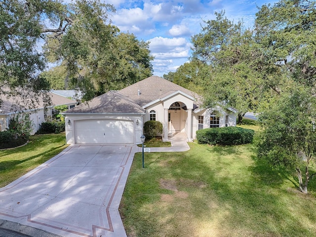 single story home featuring a front lawn and a garage