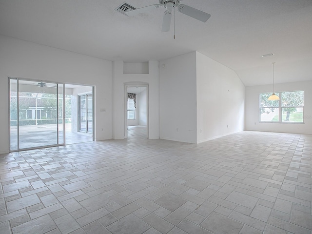 unfurnished room featuring ceiling fan and lofted ceiling