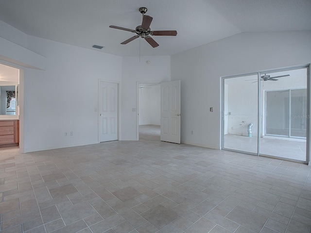 spare room featuring ceiling fan and lofted ceiling