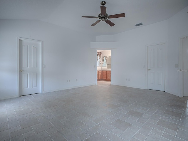 unfurnished room with ceiling fan and vaulted ceiling