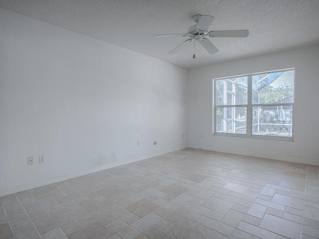 unfurnished room with a textured ceiling and ceiling fan